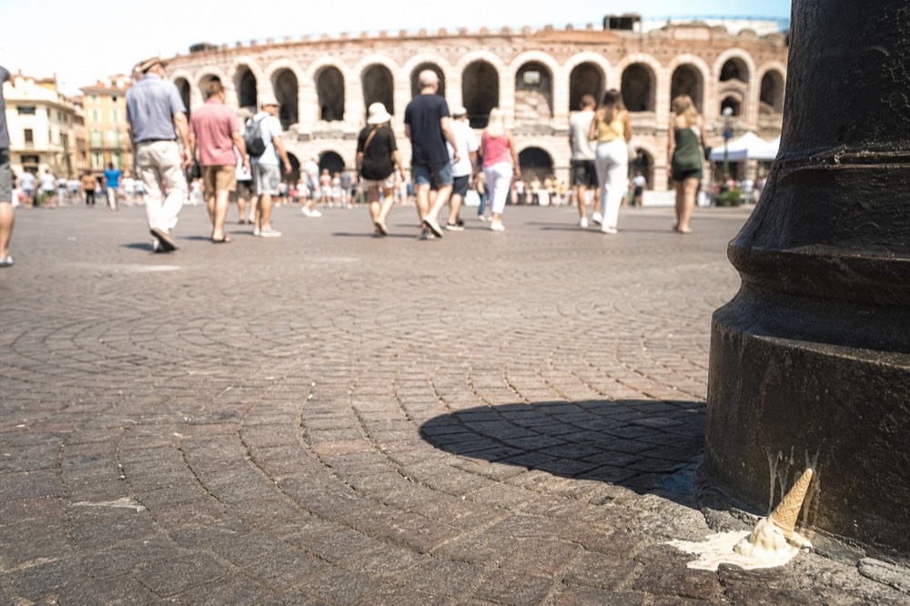 Verona Arena seen from Piazza Bra on a sunny afternoon, no text, no logos, no people